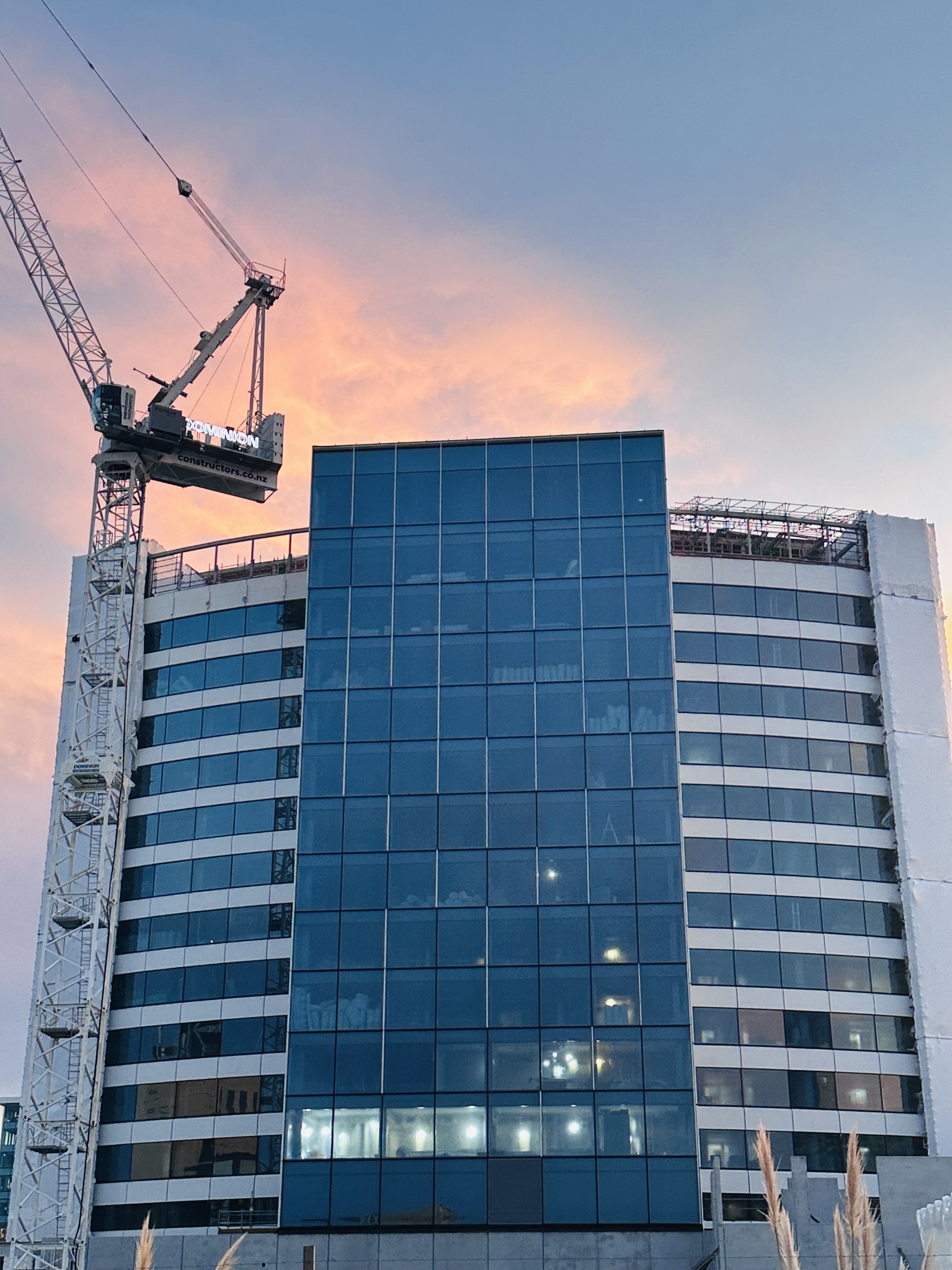 Construction cranes above the future Sheraton Christchurch at sunset.