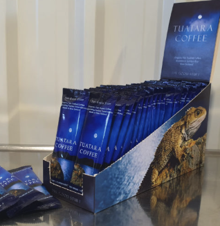 Display box of individually packed Tuatara Coffee 20 gram plunger sachets.